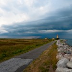 Lighthouse, looming storm