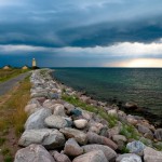 Lighthouse, looming storm